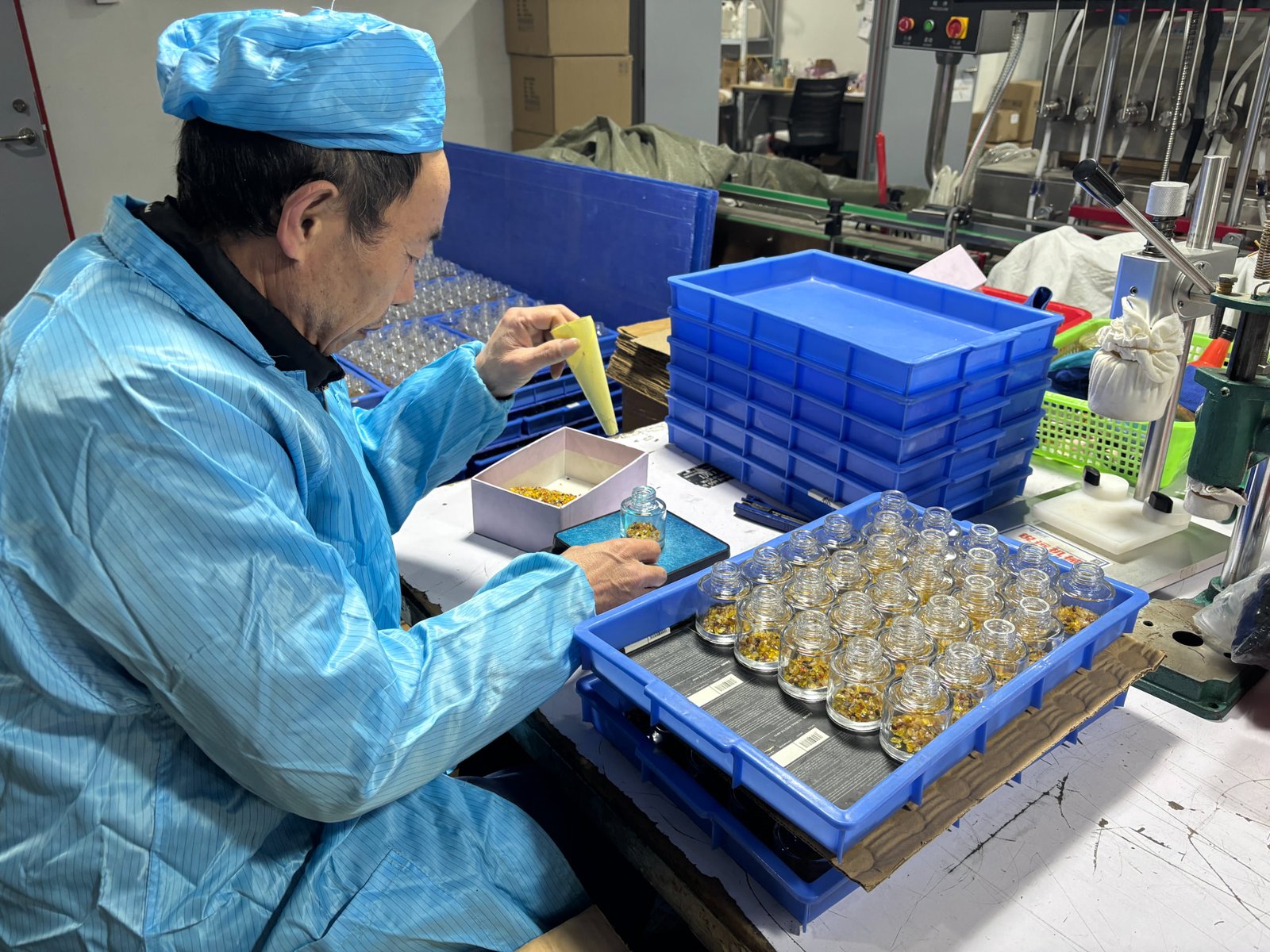 Precision wick centering in candle production